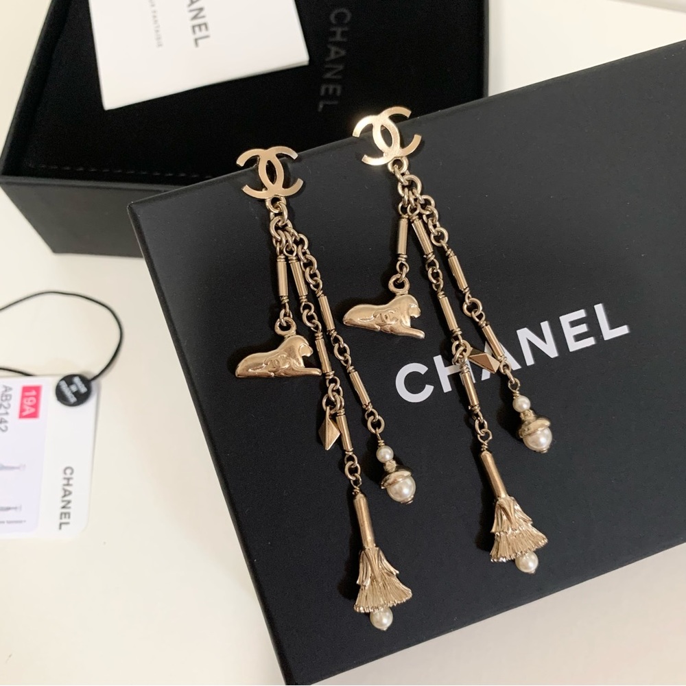 Chanel long gold pearl charm earrings